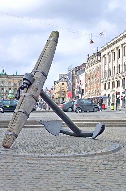 Copenhagen Denmark March10, 2013: closeup of the Memorial anchor at the Nyhavn square, unnamed tourist and local in the background