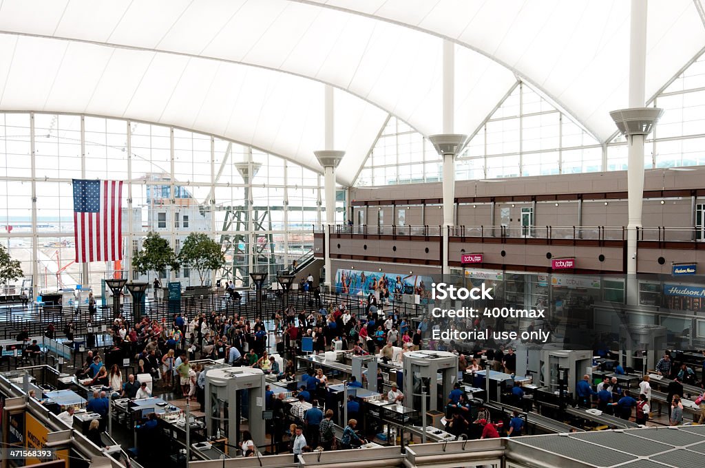 Denver International Airport Denver, USA - June 6, 2013: People traveling through security to the gates of Denver International Airport in the early morning. Transportation Security Administration Stock Photo