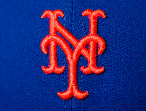 New York, USA - September 16, 2012: New York Mets emblem on baseball cap. The New York Mets are a professional baseball team based in the borough of Queens in New York City.