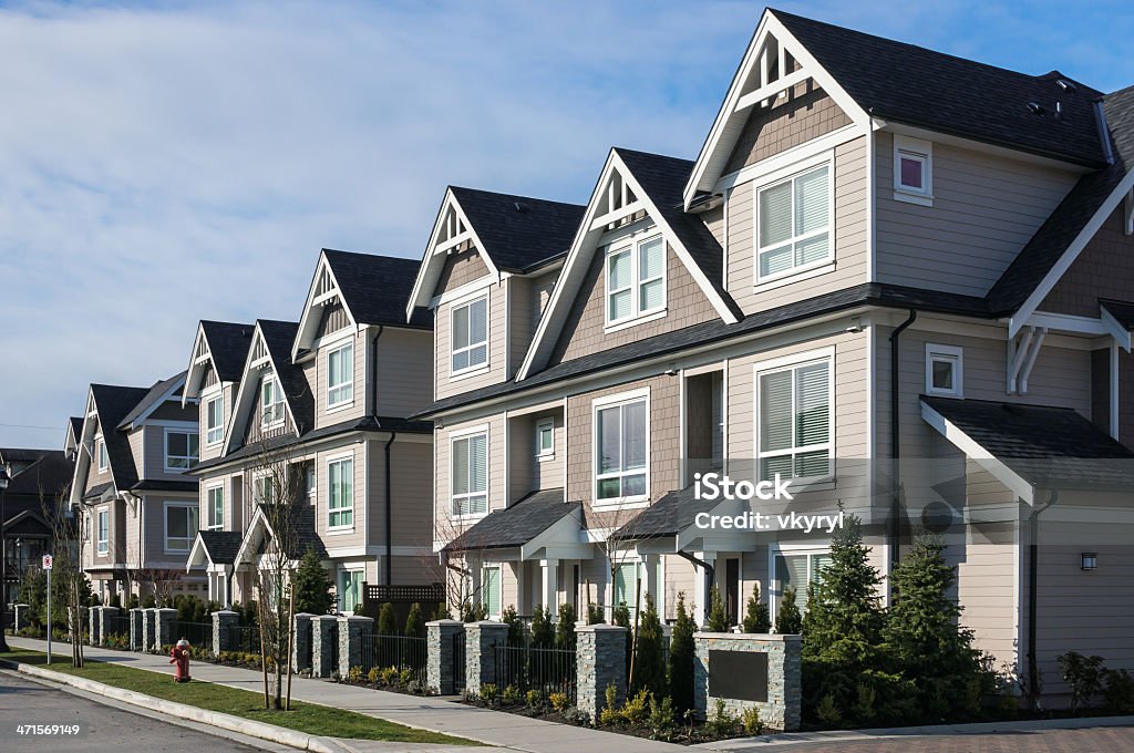 Modern cookie-cutter townhouses A row of a new townhouses in Richmond, British Columbia Townhouse Stock Photo