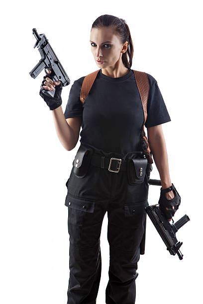 istock Police officer is holding 2 guns 471570041