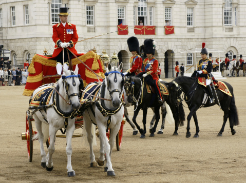 Horseguards, London - June 15, 2013. The Royal Carriage is followed by Prine Charles, Prince William and the Princess Royal, all on horseback, at the annual Trooping of the Colour