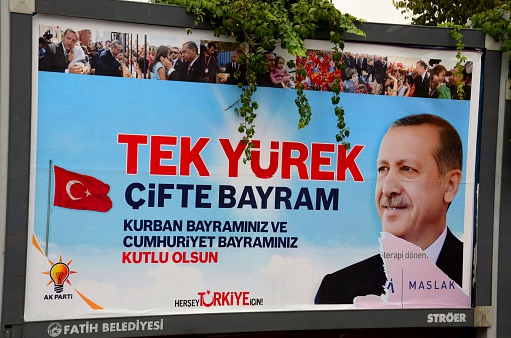 Istanbul, Turkey - October 29, 2012: An Eid (Bayram) poster of Turkish Islamist AKP party leader and Prime Minister Erdogan (2003 - present). Erdogan is also the chairman of the ruling Justice and Development Party (AKP)Erdoğan served as Mayor of Istanbul from 1994 to 1998. Presently, civil unrest against the perceived dictatorial rule of Erdogan and his AK Party is taking places in many cities across Turkey, namely Istanbul and the capital Ankara. 