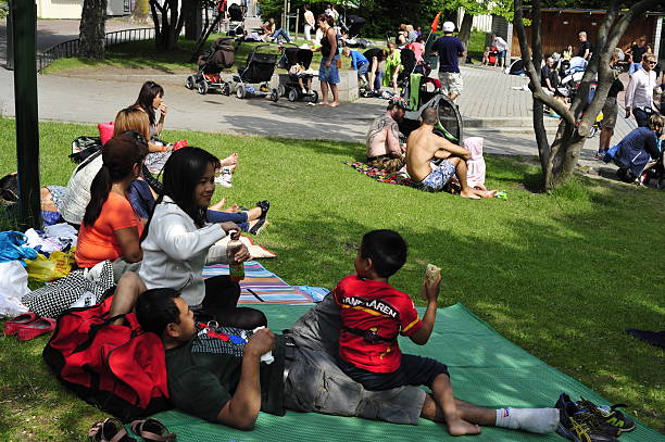 Malmo, Sweden – June 15, 2013:  Folkets Park. People relax in the park in the summer.  In Malmö Folkets Park (People's Park), people of all ages meet throughout the year.