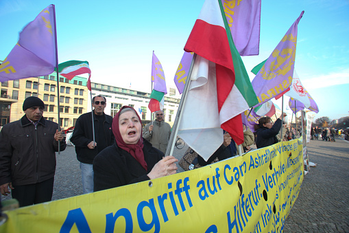 Berlin, Germany - November 3, 2011: Iranian demonstrators in front of US embassy on Parizer Platz on November 3, 2011 in Berlin, Germany. Protesters want the US to protect Irani refugees inside Ashraf Camp, Iraq.