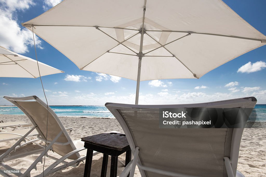 Beach with sun umbrellas and beds Caribbean beach with sun umbrellas and beds 2015 Stock Photo