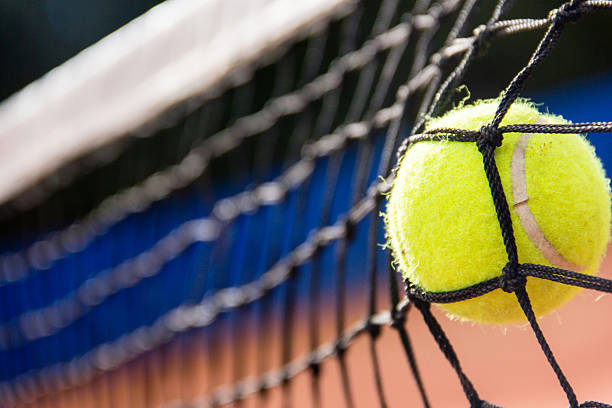 istock Tennis ball and net 471575095