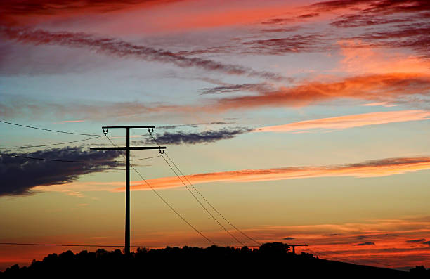 istock Electricity pylon in a rural sunset landscape 471575219