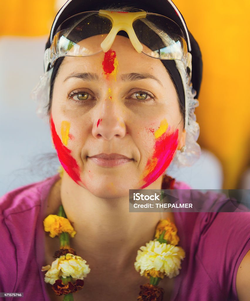 Visiting India during Holy Festival Tourist covered in color powder taking a break from participating in the festivities of holy festival 2015 Stock Photo