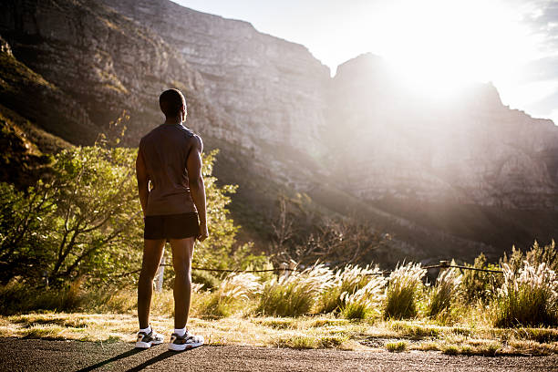 istock Fit runner happily admiring the natural beauty around him 471576252