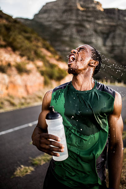 istock African American athlete shaking his wet head after exercise 471576272