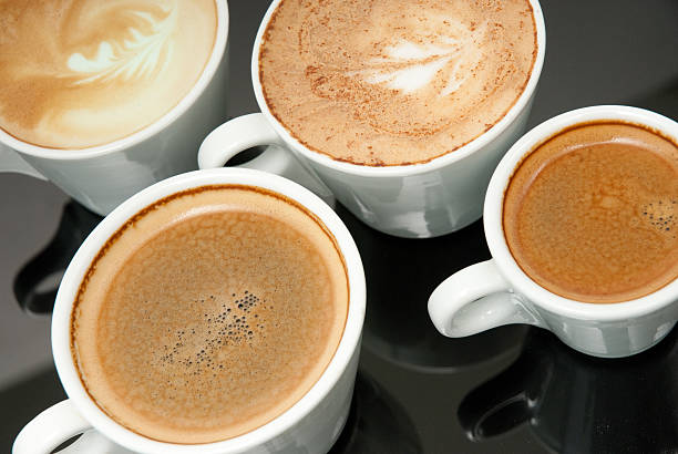 istock four white coffe cups on the black background 471576943