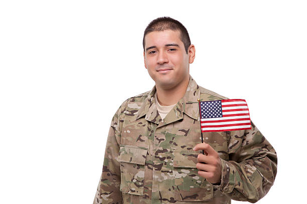 istock Smiling soldier posing with an American flag 471579109