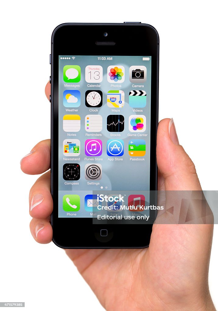 Apple iPhone 5 Izmir, Turkey - June 13, 2013 : Apple iPhone 5 smartphone displaying the homescreen. Apple announces the new iOS 7 at Apple's Worldwide Developer Conference (WWDC) in San Francisco on June 10, 2013. 25-29 Years Stock Photo