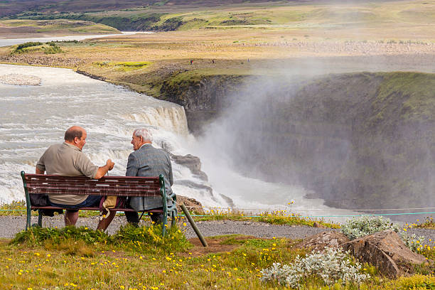 Two man on wooden bench - Iceland. stock photo