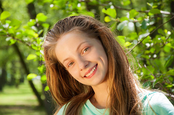 istock Young beautiful white girl in a park 471581036