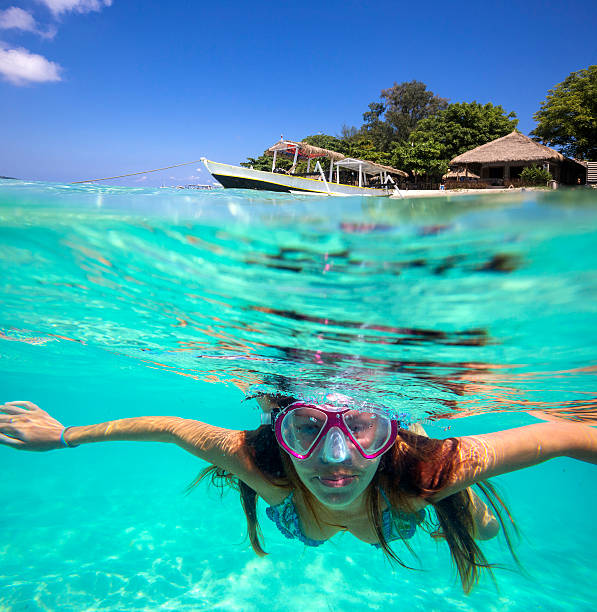 istock A young woman underwater swimming 471581104