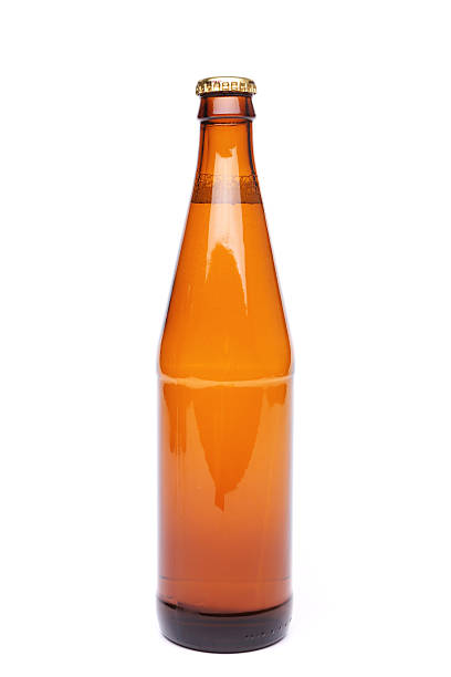 istock brown bottle with drink on white background. 471581305