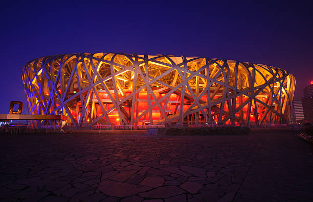 Beijing National Stadium Beijing, China - June 1, 2012: Beijing National Stadium(Bird's Nest) is the 2008 Summer Olympics main stadium,and it also was host to the Opening and Closing ceremonies.The modern and abstract design,made the Bird's Nest becoming the landmark of Beijing,even China.this photo was take in night time beijing olympic stadium photos stock pictures, royalty-free photos & images