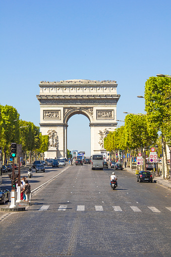 Paris, France - September 09, 2012: People and cars crossing the Champs-Elysees street.