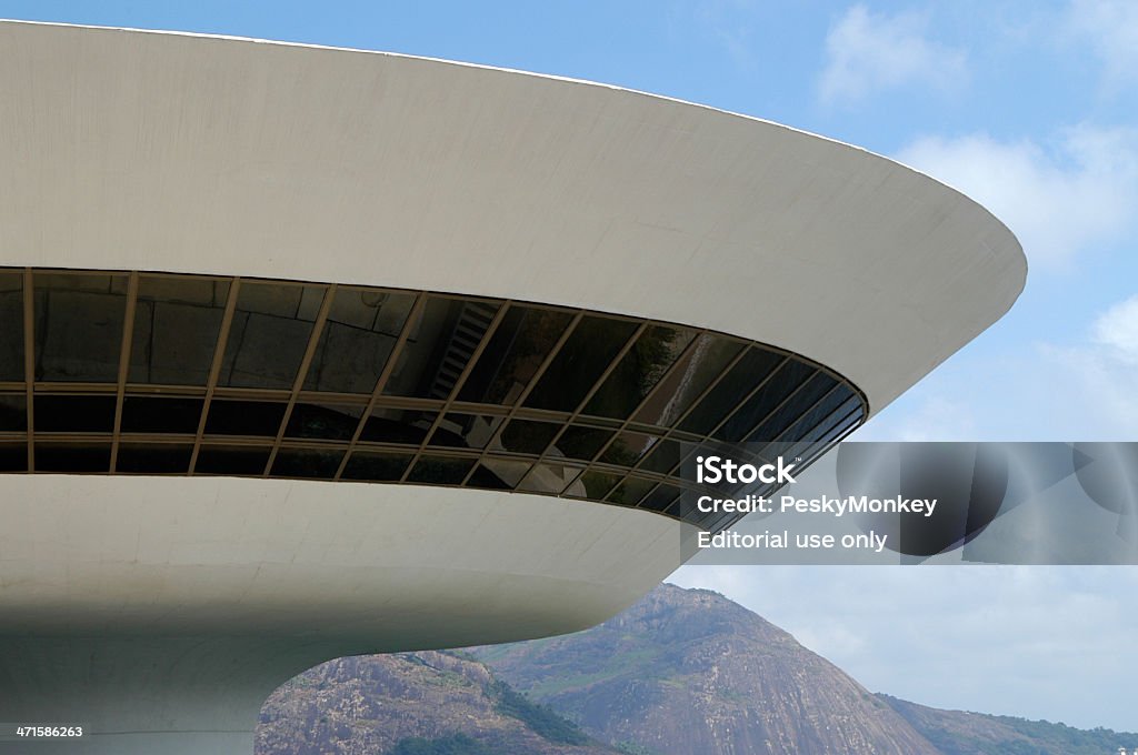 Oscar Niemeyer Niteroi Contemporary Art Museum Rio de Janeiro Brazil Niteroi, Brazil - March 5, 2003: Niterói Contemporary Art Museum stands in front of the mountainous Rio de Janeiro horizon. Designed by Oscar Niemeyer and completed in 1996, the history of the iconic building is clouded by a political corruption scandal. Oscar Niemeyer Stock Photo