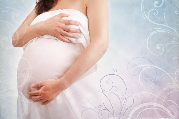 istock Pregnant woman holding her belly 471586464