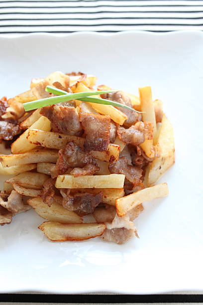 istock asian food, potato and pork stir fried 471586549