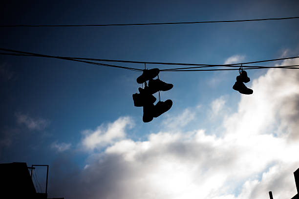 istock Shoes Hanging from Powerlines 471587180