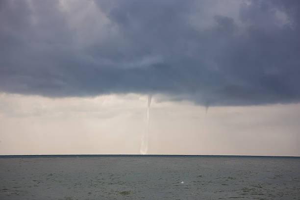 istock Tornado sucks water from the sea 471587450