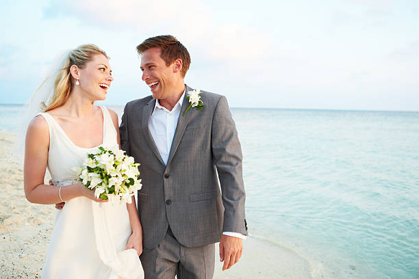 istock Bride And Groom Getting Married In Beach Ceremony 471587541