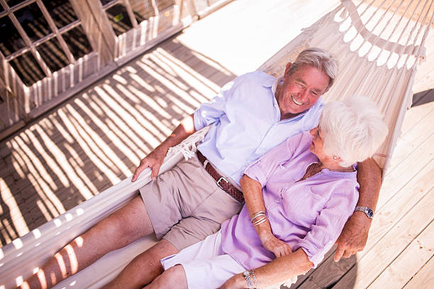 istock Retired senior couple relaxing and laughing together 471587754