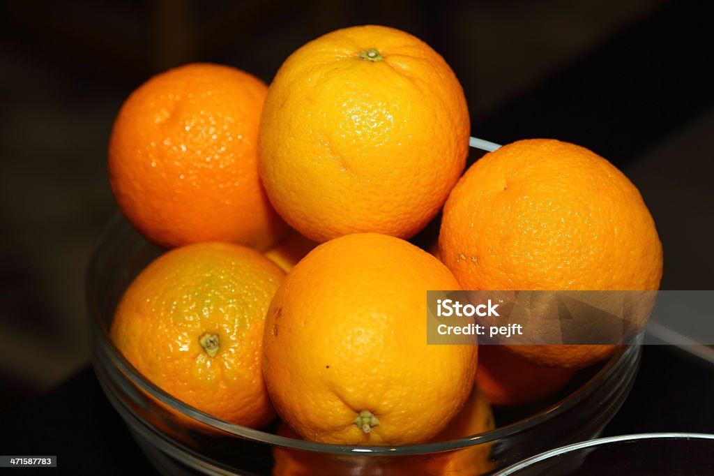 Orange in glass bowl Bowl Stock Photo