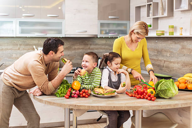 istock Happy parents with their children in the kitchen. 471587788