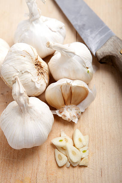 istock garlic clove on wooden board 471588540