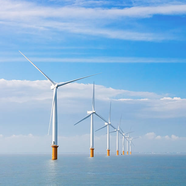 istock Electrical wind turbines at sea 471589199