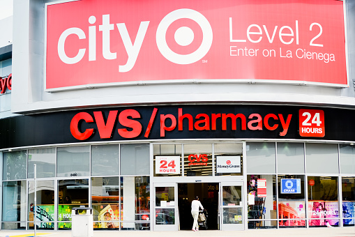 Los Angeles, USA - May 8, 2013: CVS Pharmacy on La Cienega Boulevard in West Hollywood. Woman entering drugstore