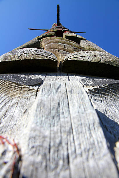 Looking Up History Sechelt, Canada - April 22, 2013: A totem pole on the waterfront of the Sechelt First Nation in Sechelt, British Columbia pacific northwest totem poles stock pictures, royalty-free photos & images