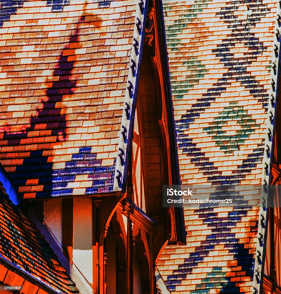 Beaune The hospice at beaune in the cote d'or department of Burgundy, France, Multi-coloured roof tiles. Architectural Feature Stock Photo