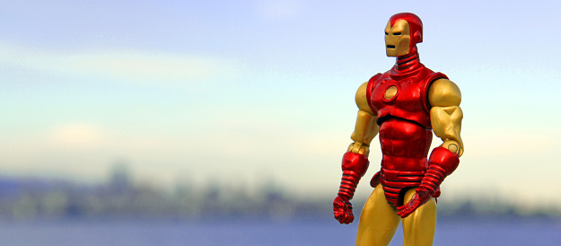Vancouver, Canada - June 6, 2013: A toy Iron Man, from the comics of the same name, strikes a heroic pose. The toy is part of the Hasbro action figures toy line.