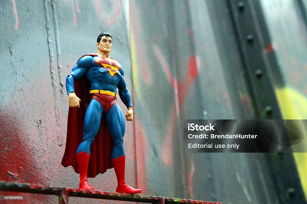 Superman and Bent Metal Whistler, Canada - June 15, 2013: An action figure model of Superman, sculpted by Paul Harding and released by DC comics, against a bent metal. Superman - Superhero Stock Photo