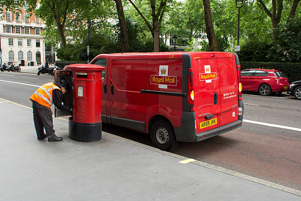 Royal Mail man collecting the post stock photo