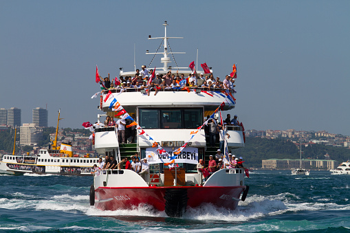 Istanbul, Turkey - June 16, 2013: Ferry carrying people to ruling AK Party (AKP) rally for free to Kazlicesme area. Meanwile Taksim area is banned for anti-government protests and police forces interfere people who is try to get in Taksim Area.