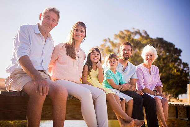istock Three generation family sitting together on a summer vacation 471593514