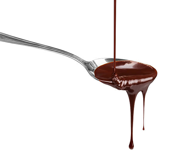 istock hot chocolate pouring stream with a spoon on a spoon on a white background 471593600