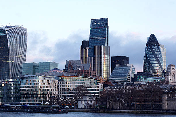 London Financial District London, England - January 29, 2015: Colour photograph of buildings City of London financial district, skyline and the Thames river early in the morning.  2010 stock pictures, royalty-free photos & images