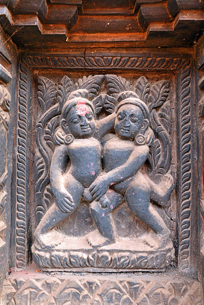 Erotic wooden carving motif on a Hindu temple in Nepal Erotic wooden carving motif on a Hindu temple in Nepal lingam yoni stock pictures, royalty-free photos & images