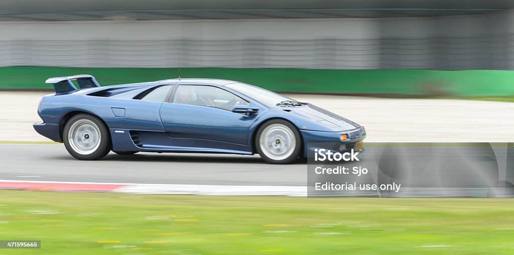 Lamborghini Diablo Assen, The Netherlands - May 19, 2013: Blue Lamborghini Diablo sports car driving at high speed. The car is driving around the track during the 2013 Viva Italia event at the Assen TT race track. 1990-1999 Stock Photo