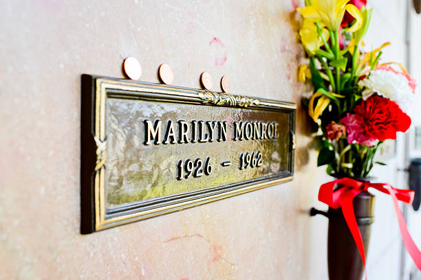 Marilyn Monroe Grave,  Los Angeles Los Angeles, USA  - May 15, 2013: Marilyn Monroe Grave with flowers and traces of kisses made by her fans, Westwood Village Memorial Park,  Los Angeles lypsela2013 stock pictures, royalty-free photos & images