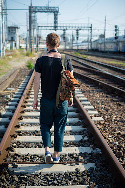 istock hipster modern stylish blonde man on rails 471596975