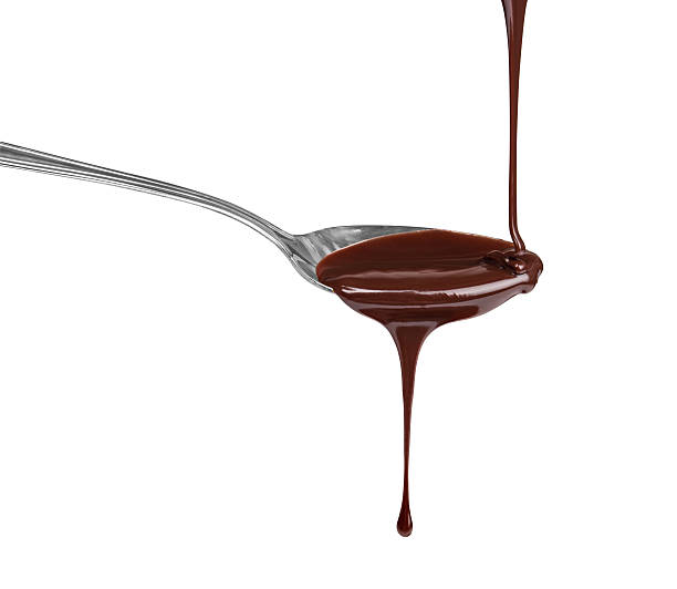 istock hot chocolate pouring stream with a spoon on a spoon on a white background 471597212